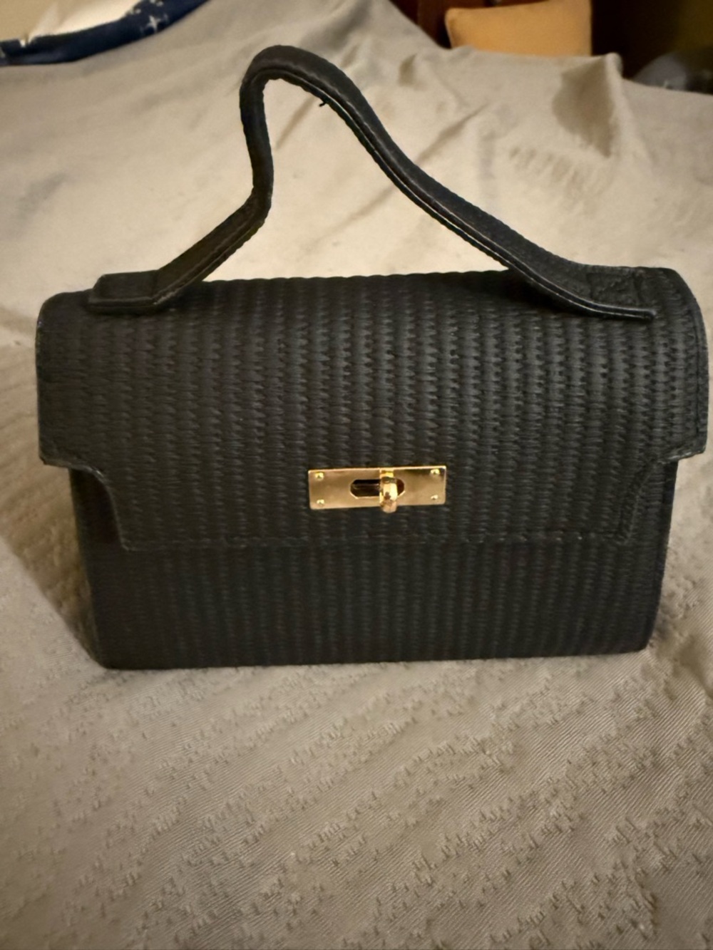 Classic Black Top-Handle Woven Handbag with Gold Turn-Lock
